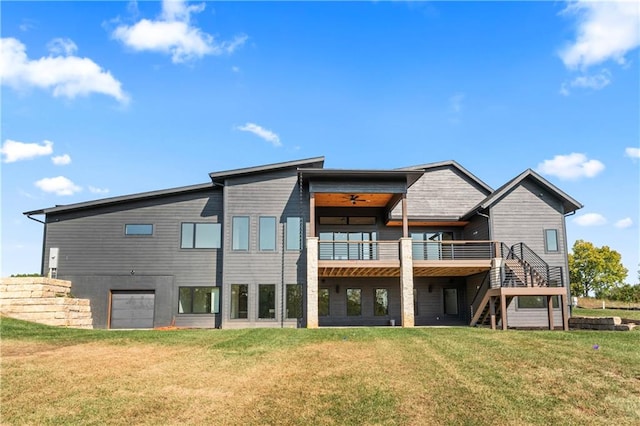 back of property featuring a wooden deck and a lawn