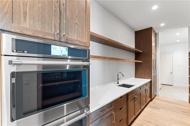 kitchen featuring sink and light hardwood / wood-style flooring