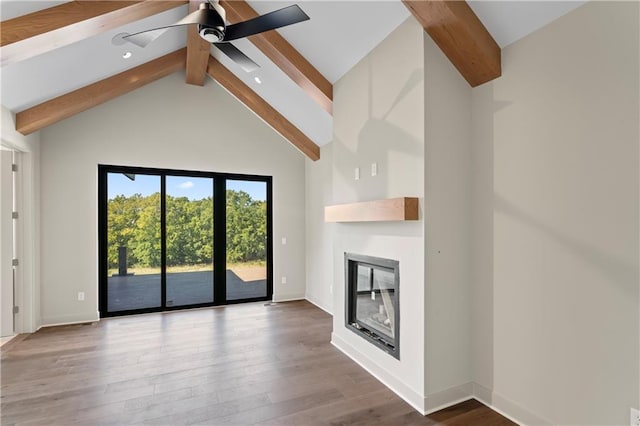 unfurnished living room featuring ceiling fan, beamed ceiling, wood-type flooring, and high vaulted ceiling