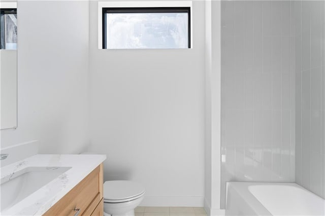 bathroom with tile patterned flooring, vanity, and toilet