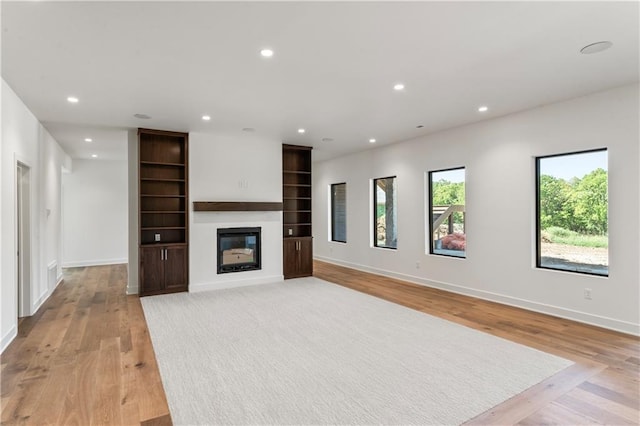 unfurnished living room featuring light hardwood / wood-style flooring