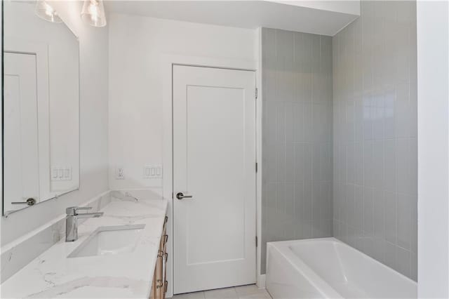 bathroom featuring vanity and a bathtub