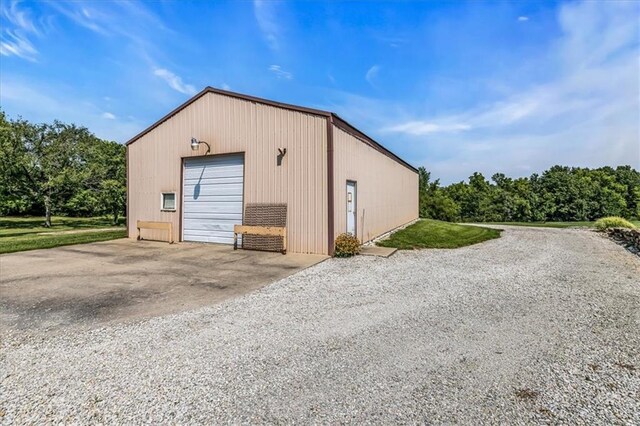 garage featuring wood walls