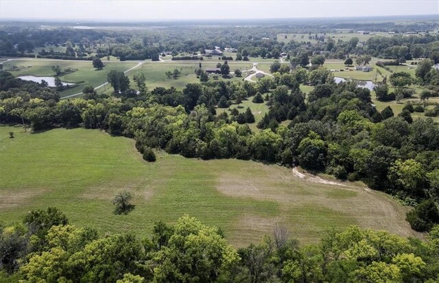 drone / aerial view featuring a water view and a rural view