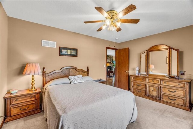 carpeted bedroom featuring ceiling fan