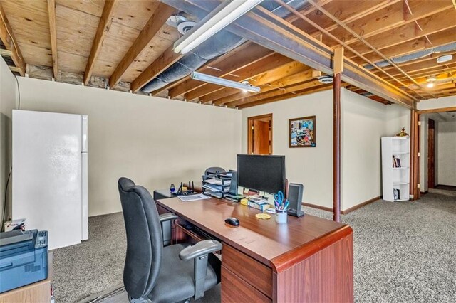 office area with light carpet and baseboards