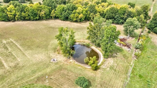 drone / aerial view featuring a water view and a rural view