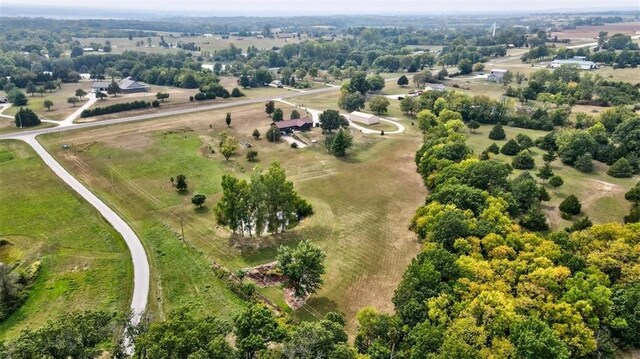 birds eye view of property with a rural view