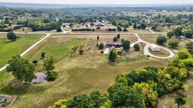 birds eye view of property featuring a rural view