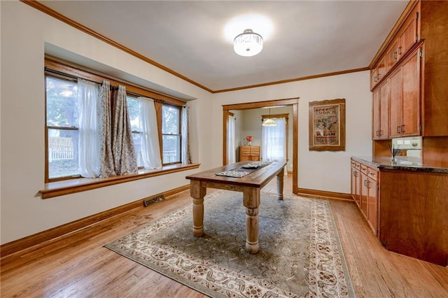 interior space with crown molding and light hardwood / wood-style flooring