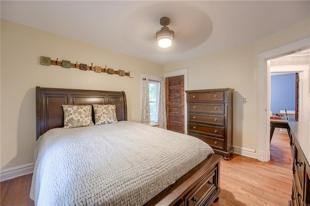 bedroom featuring light hardwood / wood-style floors and ceiling fan