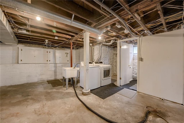 basement featuring sink and washing machine and clothes dryer