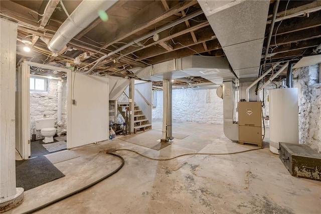 basement featuring gas water heater and heating unit