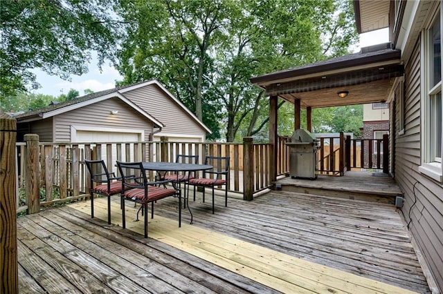 wooden deck with a grill