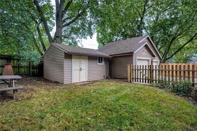 exterior space featuring a lawn and a storage unit