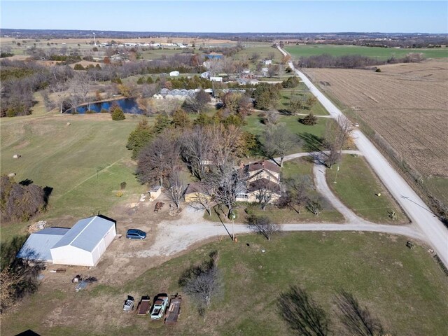 birds eye view of property featuring a rural view and a water view