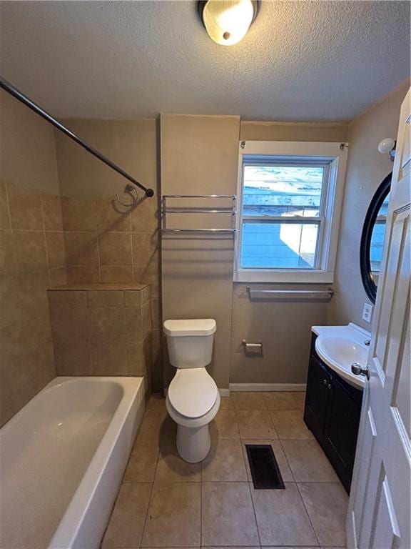 full bath featuring visible vents, toilet, a textured ceiling, vanity, and tile patterned floors