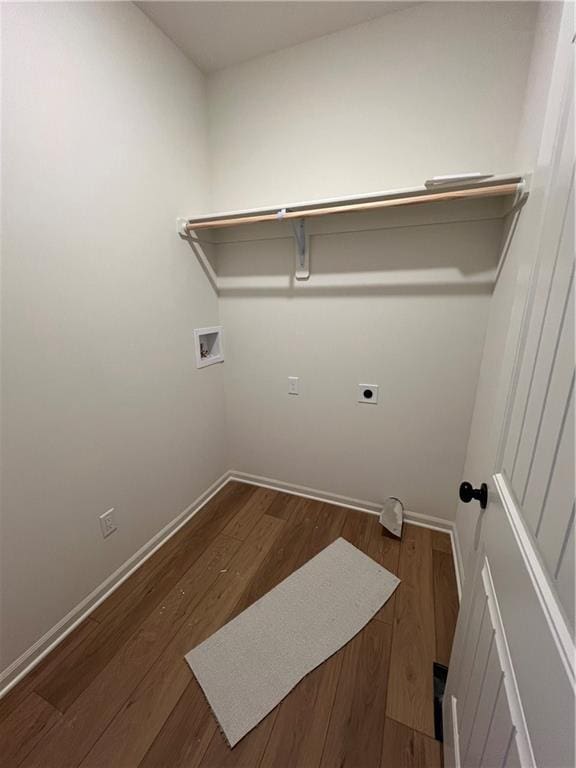 laundry room featuring washer hookup, dark hardwood / wood-style floors, and electric dryer hookup