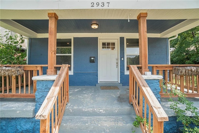 entrance to property with covered porch