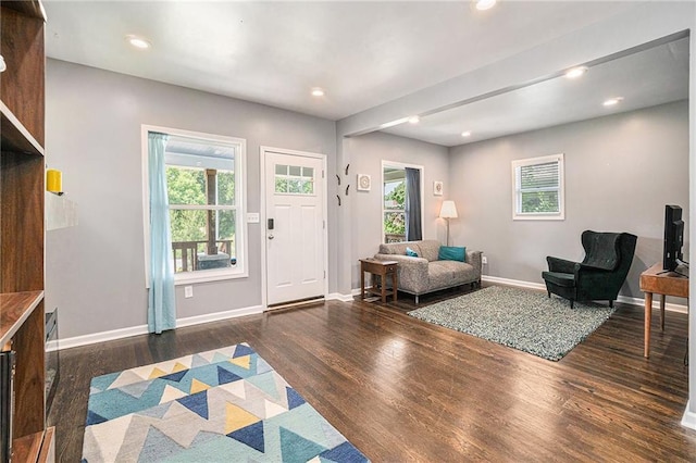 foyer with recessed lighting, wood finished floors, and baseboards