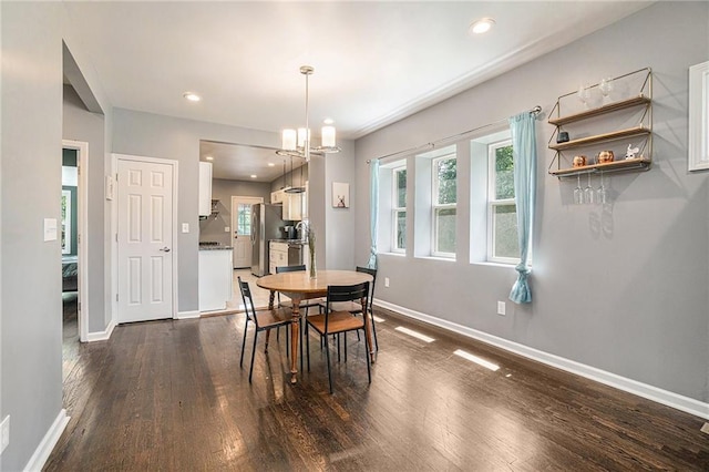 dining space featuring dark wood finished floors, recessed lighting, and baseboards