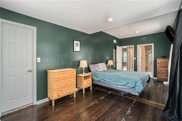 bedroom featuring baseboards and wood-type flooring