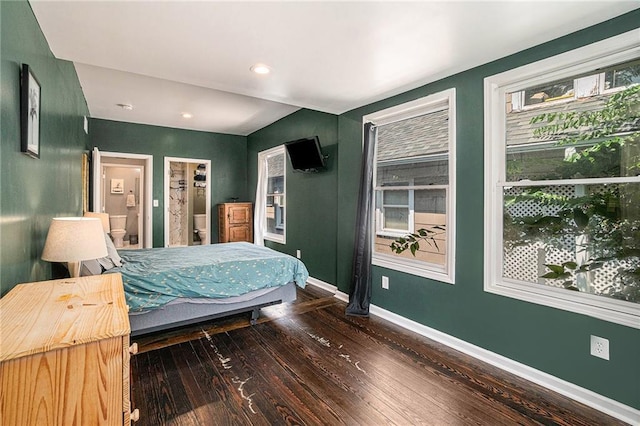 bedroom featuring recessed lighting, connected bathroom, baseboards, and hardwood / wood-style flooring