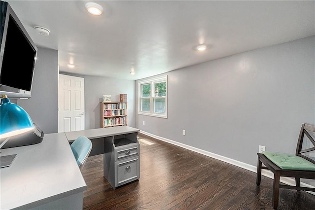 office space with dark wood-type flooring and baseboards