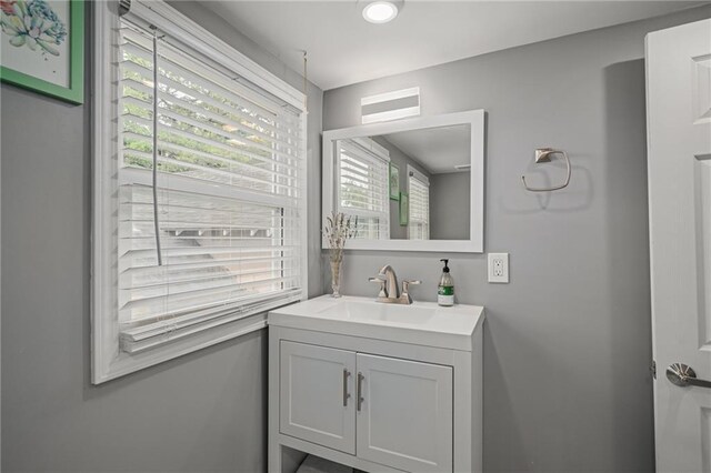 2937 Paseo Blvd, Kansas City, MO 64109 - bathroom with plenty of natural light, vanity, and recessed lighting
