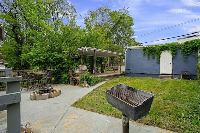 2937 Paseo Blvd, Kansas City, MO 64109 - view of grassy yard with a fire pit, a patio area, and outdoor dining area