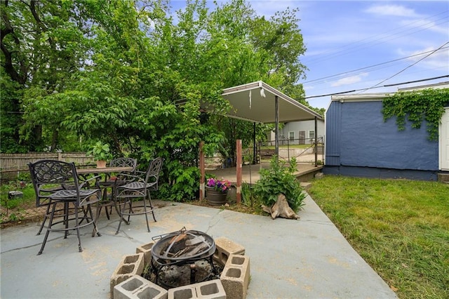 2937 Paseo Blvd, Kansas City, MO 64109 - view of patio featuring a fire pit