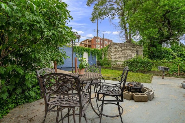 2937 Paseo Blvd, Kansas City, MO 64109 - view of patio / terrace featuring an outdoor fire pit and outdoor dining space