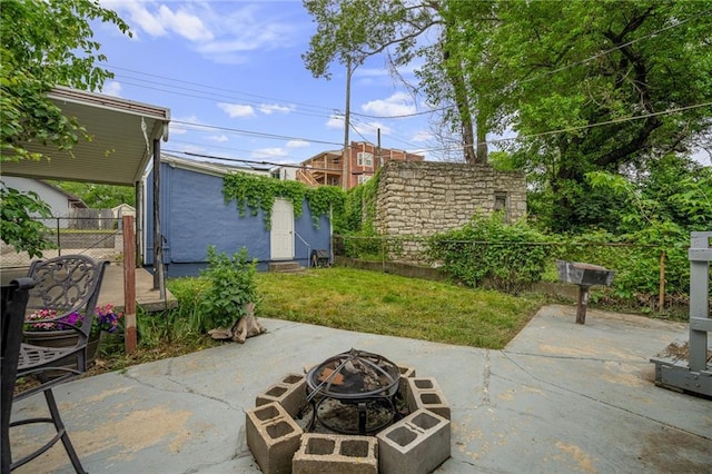 2937 Paseo Blvd, Kansas City, MO 64109 - view of patio / terrace featuring a fire pit and an outbuilding