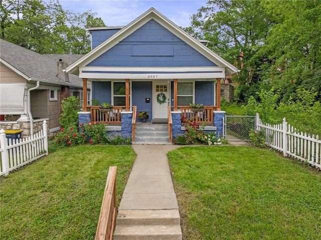 2937 Paseo Blvd, Kansas City, MO 64109 - bungalow-style house with a porch