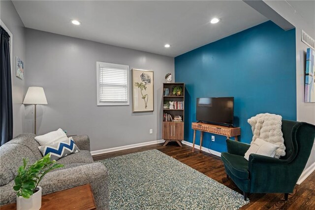 2937 Paseo Blvd, Kansas City, MO 64109 - living room featuring wood finished floors, baseboards, and recessed lighting