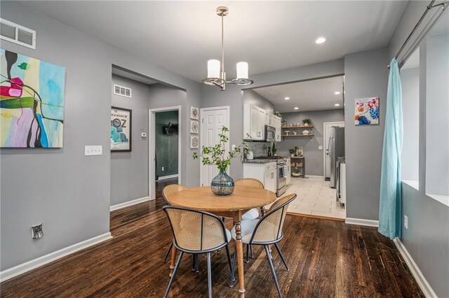 2937 Paseo Blvd, Kansas City, MO 64109 - dining area with a chandelier, baseboards, light wood-type flooring, and recessed lighting