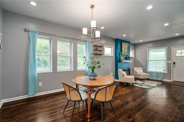 2937 Paseo Blvd, Kansas City, MO 64109 - dining room with wood finished floors, plenty of natural light, a chandelier, and recessed lighting
