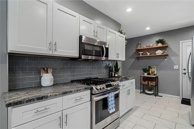 2937 Paseo Blvd, Kansas City, MO 64109 - kitchen with stainless steel appliances, open shelves, white cabinets, backsplash, and recessed lighting