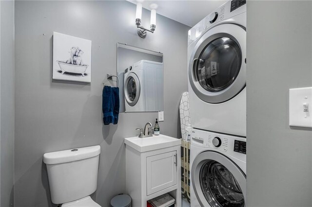 2937 Paseo Blvd, Kansas City, MO 64109 - laundry room featuring stacked washer / drying machine