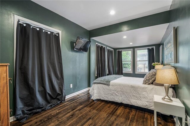 2937 Paseo Blvd, Kansas City, MO 64109 - bedroom with wood finished floors, baseboards, and recessed lighting