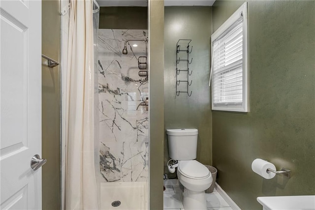 2937 Paseo Blvd, Kansas City, MO 64109 - full bathroom with a shower stall, toilet, and baseboards