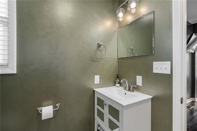 2937 Paseo Blvd, Kansas City, MO 64109 - bathroom featuring vanity and wood finished floors