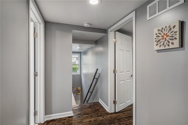 2937 Paseo Blvd, Kansas City, MO 64109 - corridor featuring an upstairs landing, dark wood-style floors, and baseboards