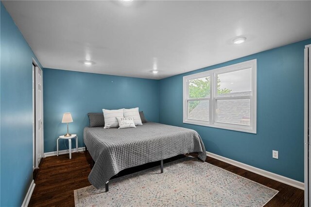 2937 Paseo Blvd, Kansas City, MO 64109 - bedroom featuring wood finished floors and baseboards
