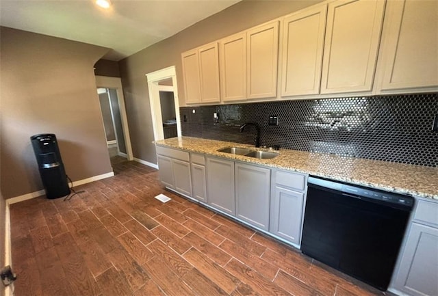 kitchen with sink, tasteful backsplash, dark hardwood / wood-style flooring, and dishwasher