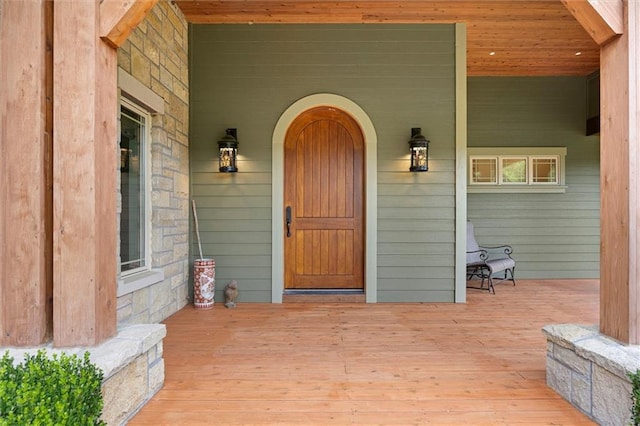 doorway to property with covered porch