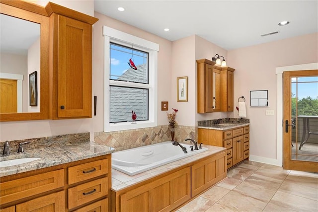 bathroom featuring vanity and a bathtub