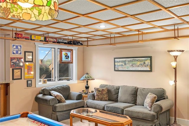 living room with coffered ceiling