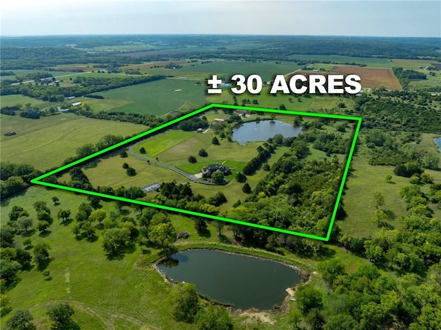 aerial view featuring a rural view and a water view