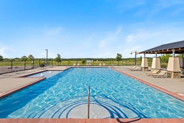 view of pool featuring a patio area